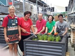 Penny, Ann, John, Sara and Tony at Bunnings Tower Junction filling planter boxes.